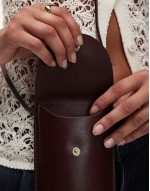 leather cross body phone case in burgundy