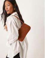 faux suede shoulder bag with skinny straps in brown