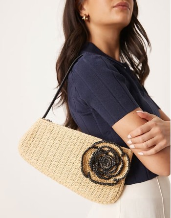 straw asymmetric shoulder bag with contrast stitch flower corsage in neutral