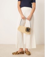 straw asymmetric shoulder bag with contrast stitch flower corsage in neutral